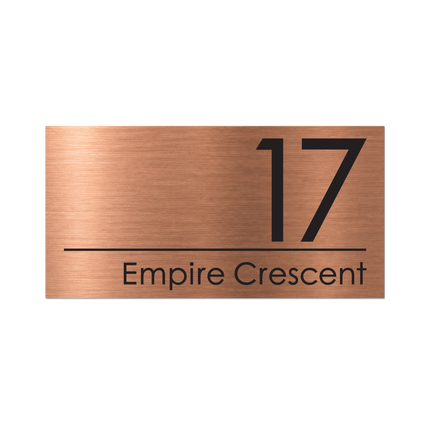 Large brushed copper metallic house sign, 400 x 200 mm, with the house number and street name cut through to a black plate