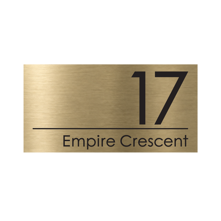 Large brushed gold metallic house sign, 400 x 200 mm, with the house number and street name cut through to a black plate