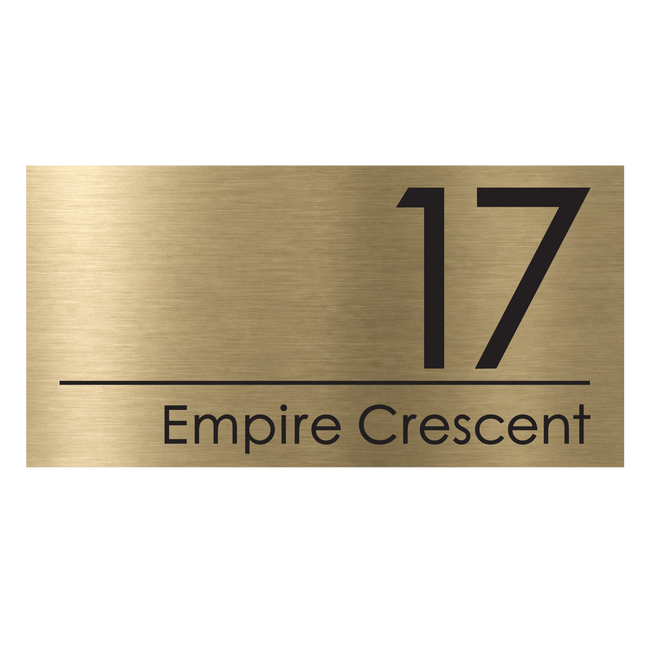 Extra large brushed gold metallic house sign, 500 x 250 mm, with the house number and street name cut through to a black plate