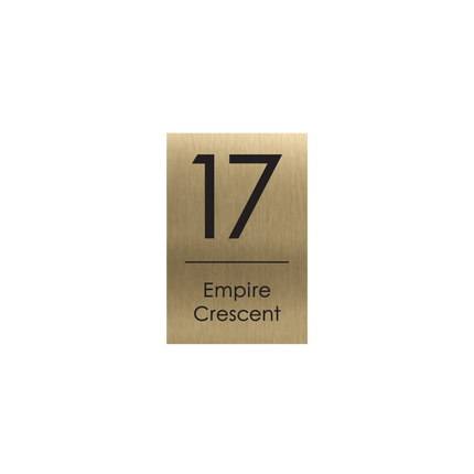 Small portrait brushed gold metallic house sign, 165 x 250 mm, with the house number and street name cut through to a black plate