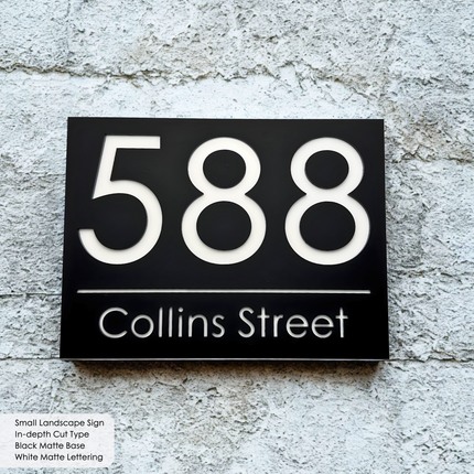 Custom sign black base white letters in-depth cut