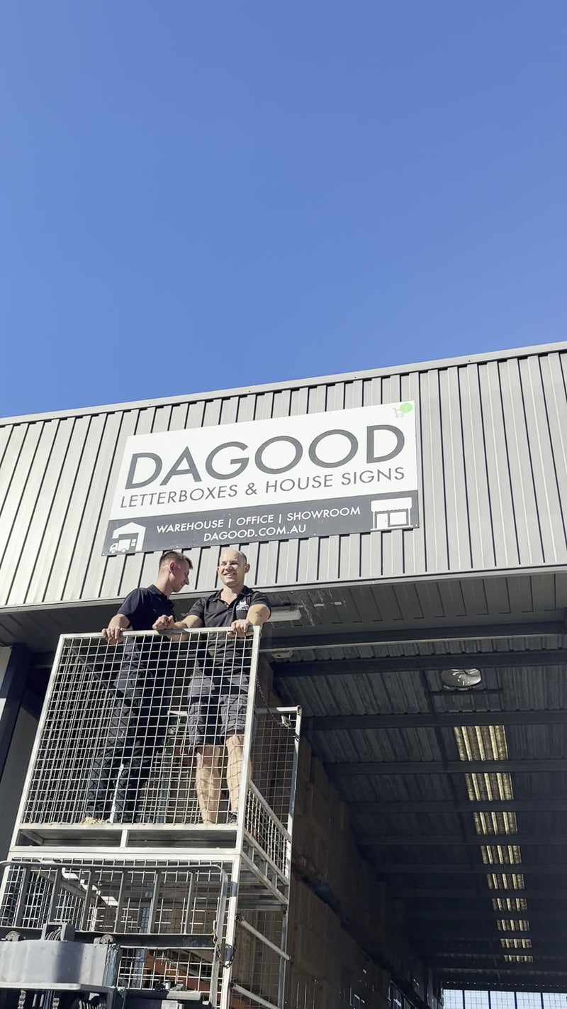 The Dagood sign going up on the new warehouse